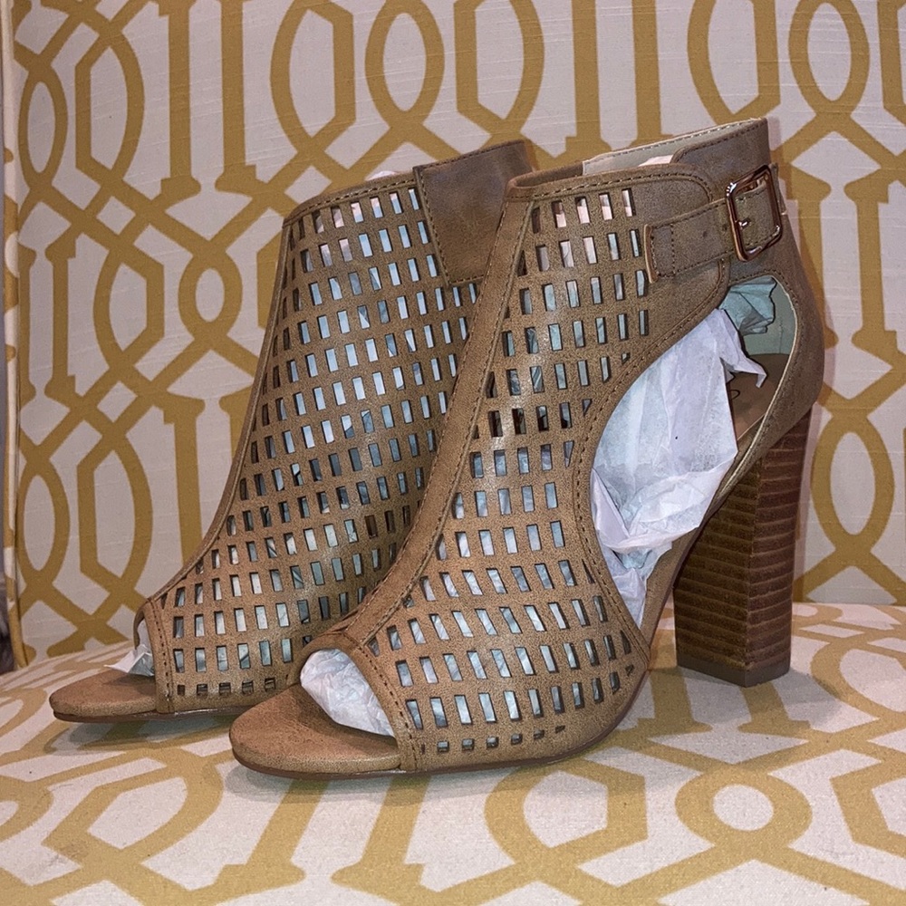 Peep toe laser cut faux leather heeled booties